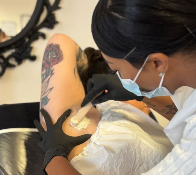 Waxing treatment being carried out in a training salon