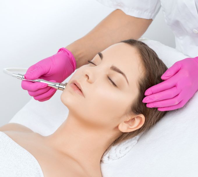 Client receiving a microdermabrasion facial