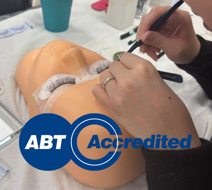 Student applying hybrid eyelash extensions during training