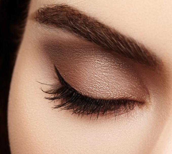 Close-up of a groomed brow and eyeshadow