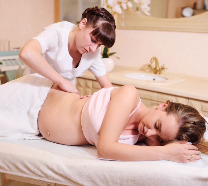 Therapist giving a pregnancy massage