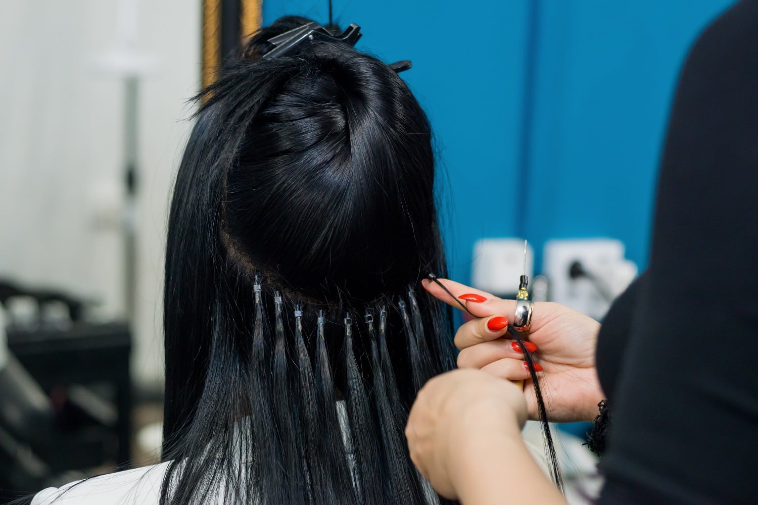 Nano ring hair extensions being fitted